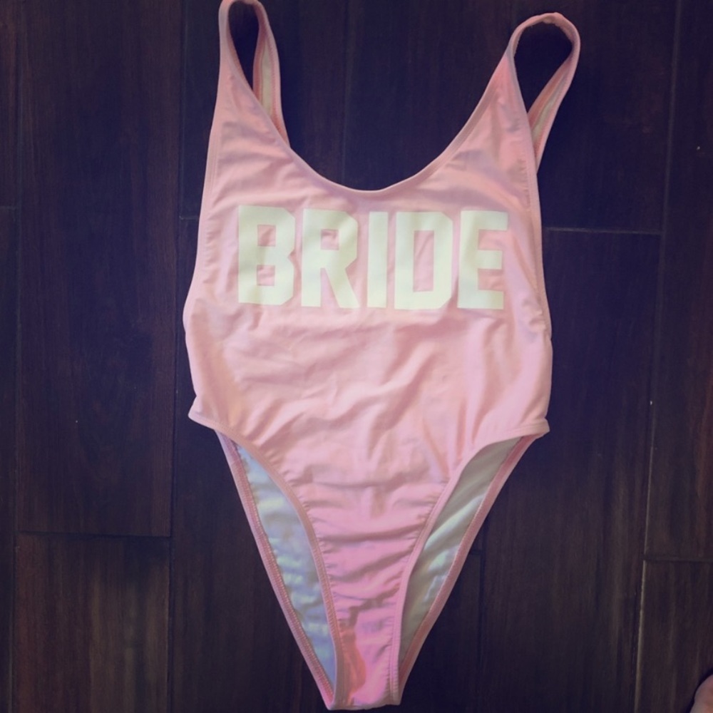 Light pink one piece with white BRIDE.